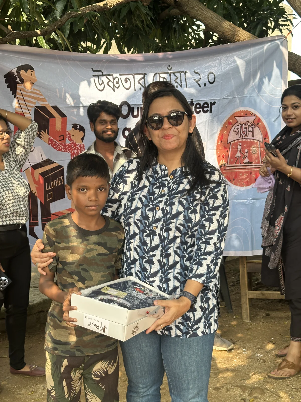 Sharing Puja clothes with the children.